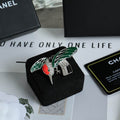 Chanel Bird Brooch with Green Wings and Red Accent