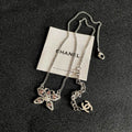 Chanel Silver-Tone Crystal Bow Necklace with CC Charm