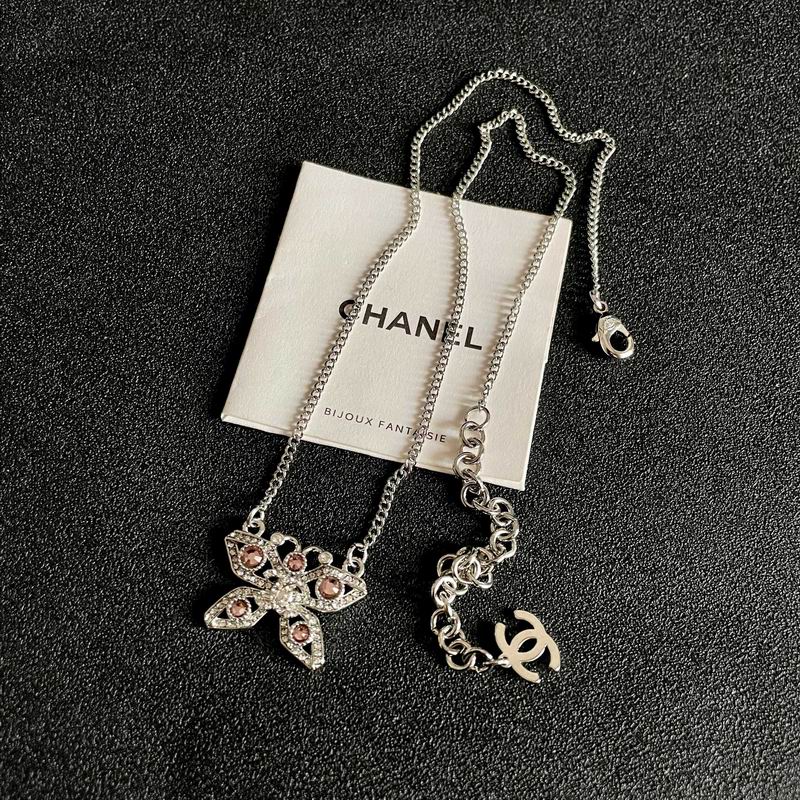 Chanel Silver-Tone Crystal Bow Necklace with CC Charm